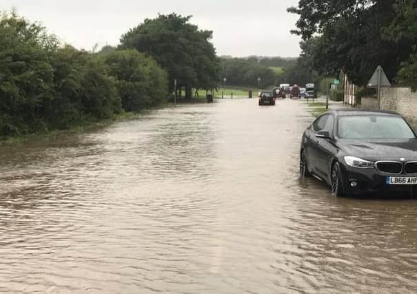 Cars were left abandoned in the flood water