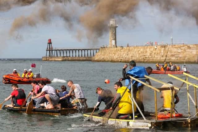 Raft race action at Whitby Regatta . Saturday 18 August. Whitby Regatta 2017. Picture: Ceri Oakes w173002f