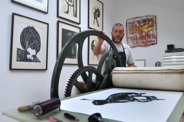 Andrew in his home studio
