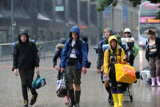 Early Leeds Festival goers brave the rain in Leeds this morning. Picture Jonathan Gawthorpe