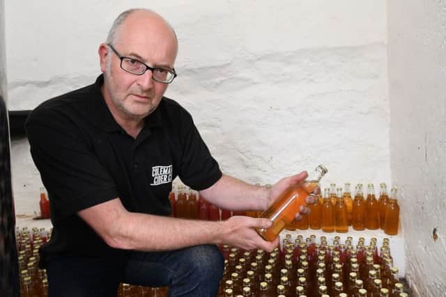 Residents can take their surplus fruit and are paid in apple juice or cider