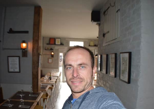 Funny Onion owner Robert Redshaw is pictured in the renovated Coach House Bistro.