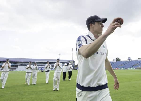 Yorkshire's Matthew Fisher is congratulated on taking 5 wickets in the innings against Warwickshire.