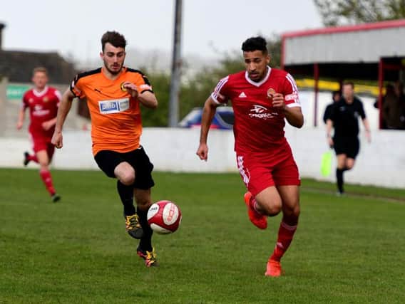 Nathan Curtis, red short, in action for Ossett Town