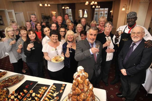 Mount Hotels general manager Roberto Ramirez, along with staff and special guests, celebrate executive chef Ousseynou Wades arrival. (174731)