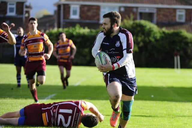 Harry Domett races clear to touch down for Scarborough. Picture by Andy Standing.