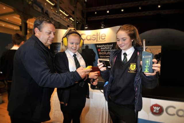 Scarborough Engineering Week 2017 .Paul Bartle of Castle shoe St Augustines pupils Izzy Monty and Olivia Proctor some of the gadgets . pic Richard Ponter 174912b