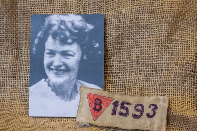 Picture shows an image of Andre Antoine-Dumont and Mauthausen Concentration Camp inverted red triangle and number on display at Eden Camp Museum.