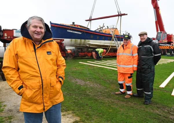 Dave Freeman with Graham Lount, who was part of the launching crew, and Bill McPhee, site manager at Thornwick Bay