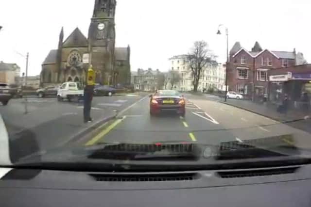 Man wearing cone caught on dash cam