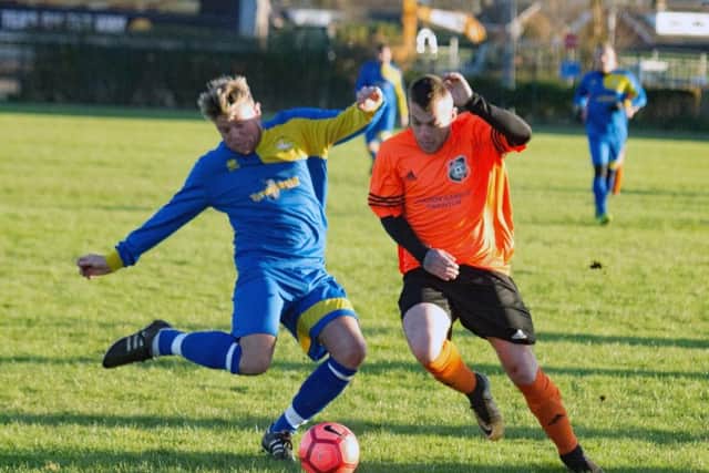 Falsgrave, blue and yellow kit, take on Snainton