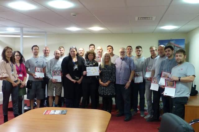 SWR Mind presents a thank you certificate to SWC Trade Frames.