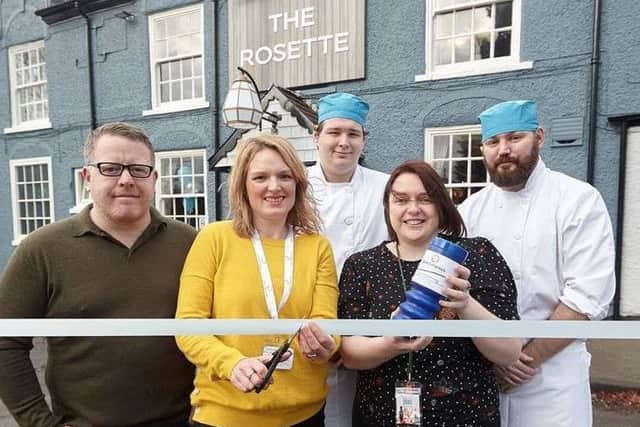 Frances Kitson from St Catherines cuts the ribbon to reopen The Rosette pub alongside regional manager Mark Lamb and team members Liam Blakey, general manager Suzanne Blacker, and John-Paul Dunne.