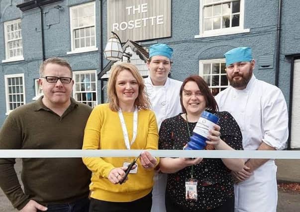 Frances Kitson from St Catherines cuts the ribbon to reopen The Rosette pub alongside regional manager Mark Lamb and team members Liam Blakey, general manager Suzanne Blacker, and John-Paul Dunne.