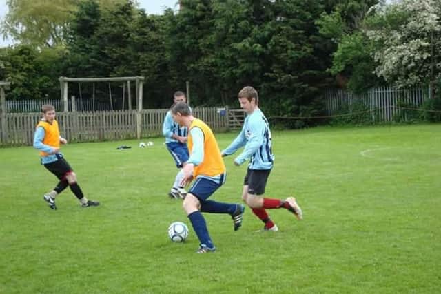 A memorial match is being played in tribute to Danny Stevens, pictured in action for Ayton FC, blue striped shirt