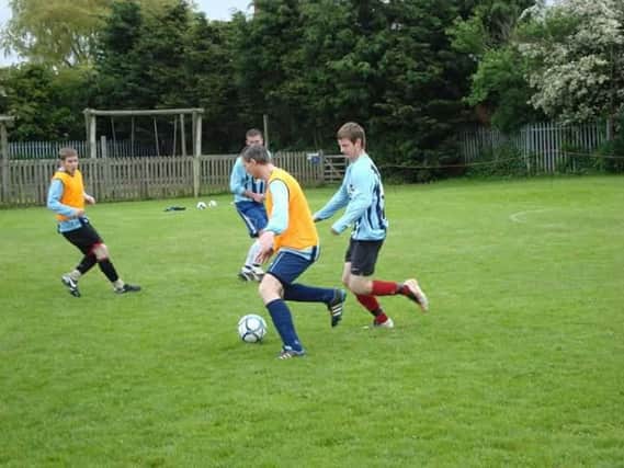 A memorial match is being played in tribute to Danny Stevens, pictured in action for Ayton FC, blue striped shirt