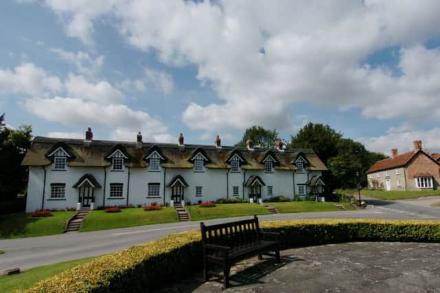 Thatched cottages in the village of Warter, East Yorkshire.