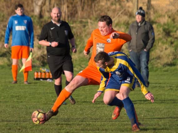 Scalby Reserves (orange) on the ball during their 9-1 hammering at Filey Town Reserves. Picture by Steve Lilly.