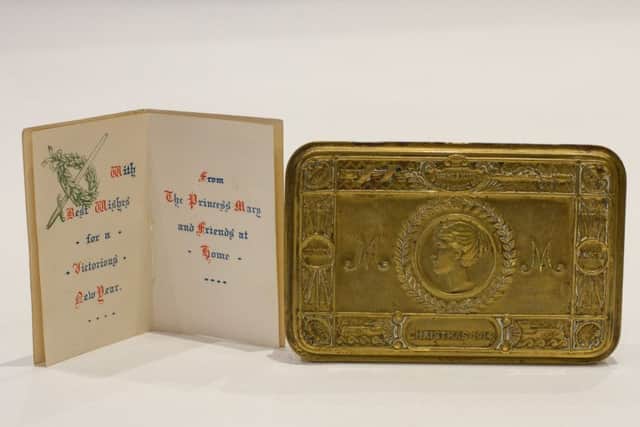 Princess Mary brass tin and Christmas card on display at Eden Camp Museum, Malton.