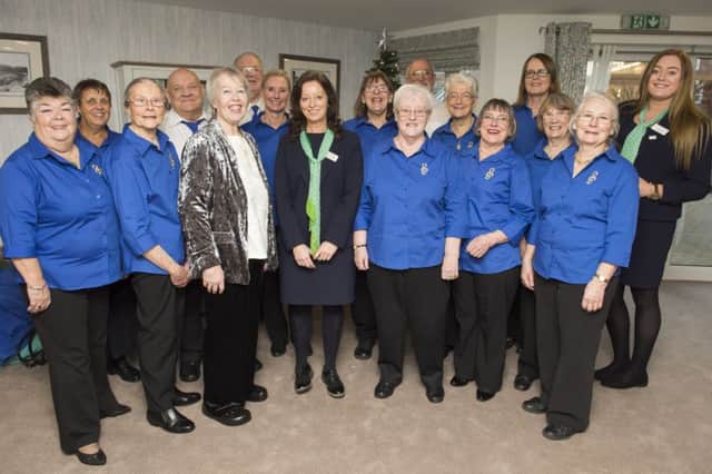 The Chantons Choir is pictured with McCarthy and Stones Julie Middleton and Camilla Tite.