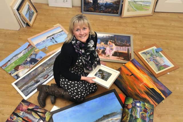 Venues and volunteers manager Julie Baxter viewing some Scarborough memories artwork to be exhibited.