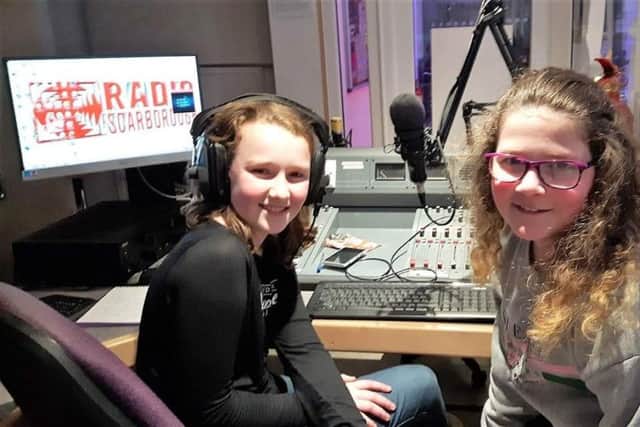 Katie Robinson and Grace Mellor, both 11 and pupils at St Augustine's School, on air with Radio Scarborough.