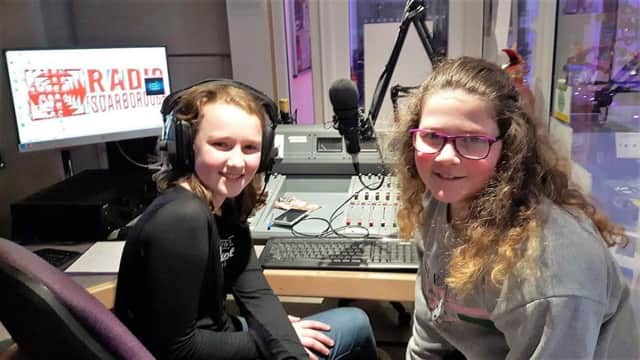 Katie Robinson and Grace Mellor, both 11 and pupils at St Augustine's School, on air with Radio Scarborough.