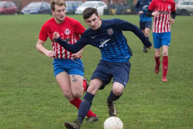 Macca Youngson on the ball for Angel Reserves at Radio Scarborough during their 6-0 win