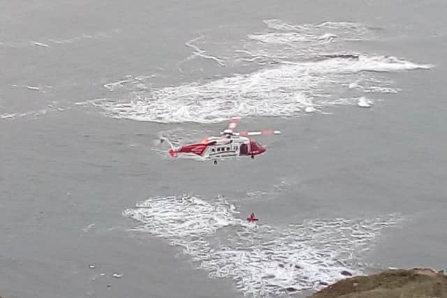 The woman was airlifted to safety