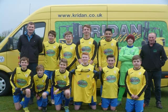 Heslerton Under-14s show off their new kit, sponsored by Kridan Forklifts, before they beat Pickering 3-1