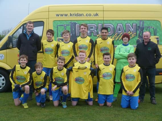 Heslerton Under-14s show off their new kit, sponsored by Kridan Forklifts, before they beat Pickering 3-1