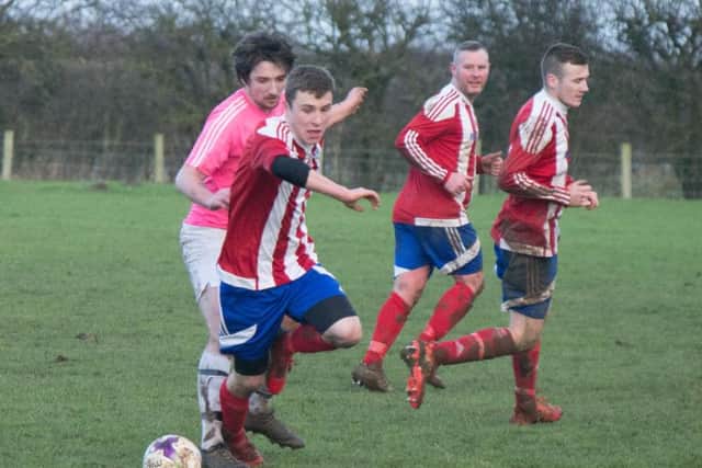 Hunmanby United on the ball during their 7-0 win against Flamborough. Pictures by Steve Lilly.