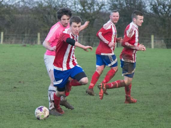 Hunmanby United on the ball during their 7-0 win against Flamborough. Pictures by Steve Lilly.
