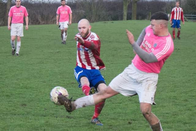 Hunmanby and Flamborough battle for the ball. Picture by Steve Lilly.