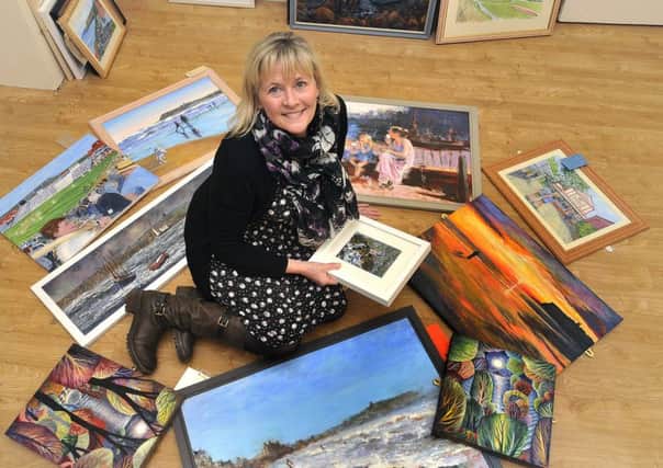 Scarborough Art Gallery .Venues and Volunteers Manager Julie Baxter viewing some Scarborough memories artwork that is to be exhibited. pic Richard Ponter 180225b