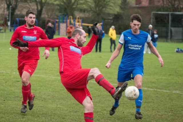 Newlands, red kit, in action against Trafalgar Picture by Steve Lilly