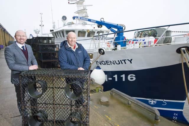 Paul Craske from Royal Bank of Scotland and Iain Gray, owner of Galwad Y Mor Shellfish Bridlington, with the new fishing vessel Ingenuity.
