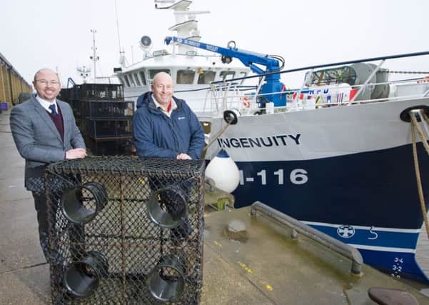 Paul Craske from Royal Bank of Scotland and Iain Gray, owner of Galwad Y Mor Shellfish Bridlington, with the new fishing vessel Ingenuity.