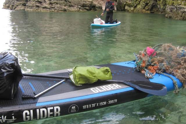 Litter Steve has recovered on his paddle board.