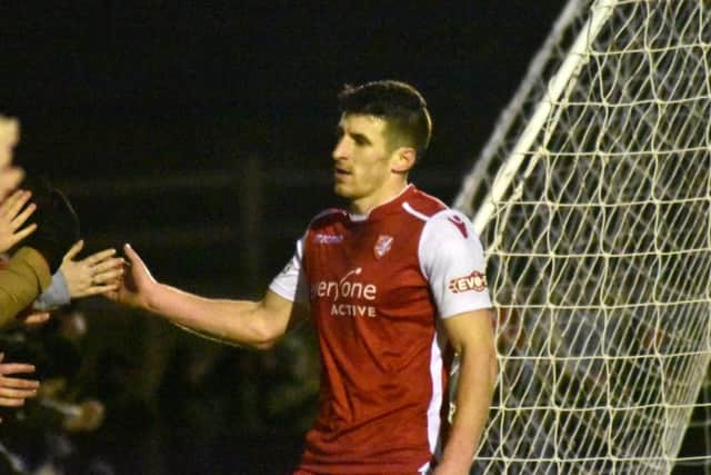 Michael Coulson celebrates with the Boro fans