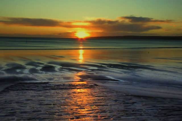 Julia West took this excellent sunrise picture while walking on Filey beach.