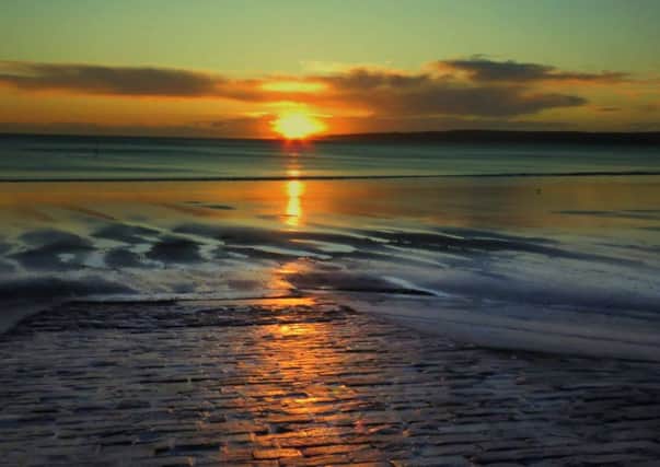 Julia West took this excellent sunrise picture while walking on Filey beach.