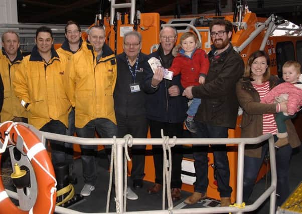 Henry Pulling, his wife Rebecca and their children Joshua, 3, and Esme, 22 months, at the Scarborough lifeboathouse presentation.