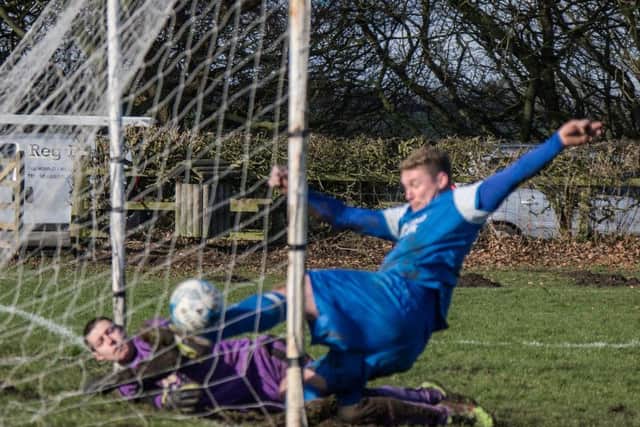 Liam Salt slides in after Curtis Rose's equaliser for Traf against Sessay in the NRCFA Sunday Challenge Cup quarter-final at Oliver's Mount Picture by Steve Lilly
