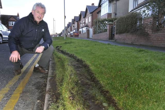 Huw Roberts with the destruction to the grass verge