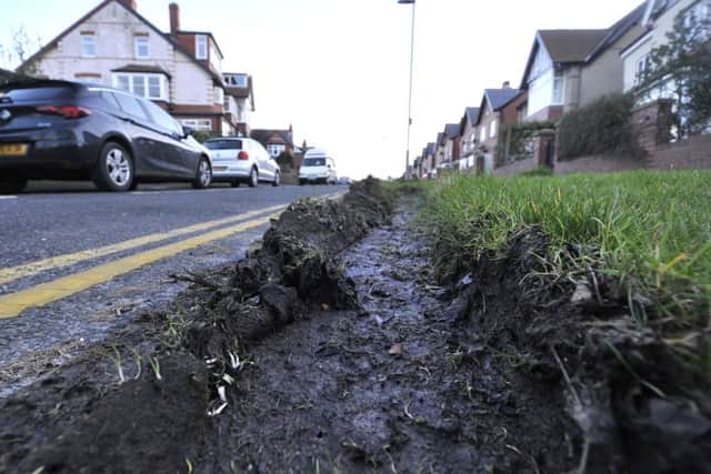 The damage has been caused by vehicles mounting the kerb and travelling too fast .