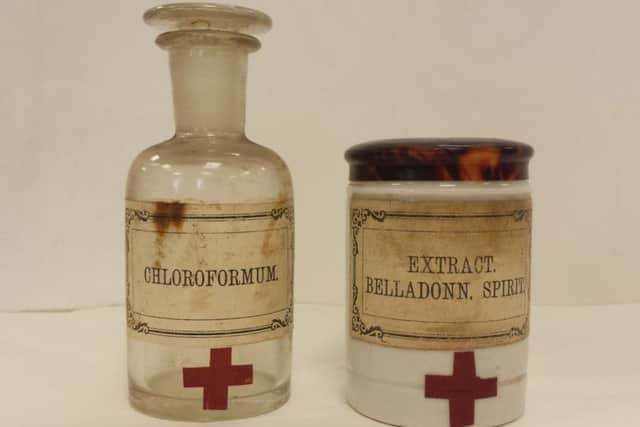 Two bottles fom the cabinet containing chloroformum and Belladonna spirit.