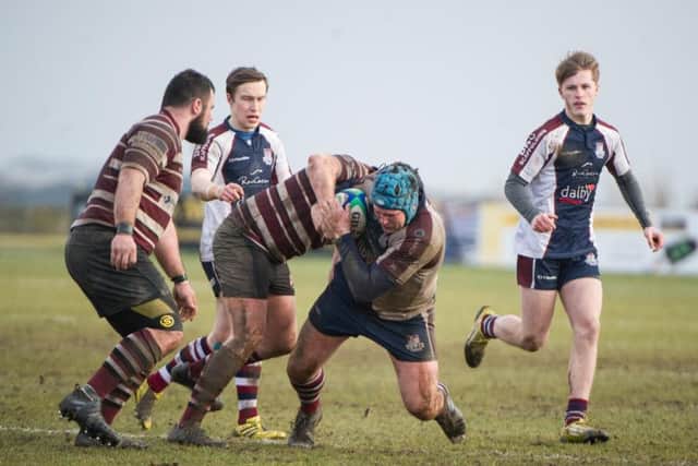 Scarborough's Phil Watson is halted. Picture by Andy Standing.