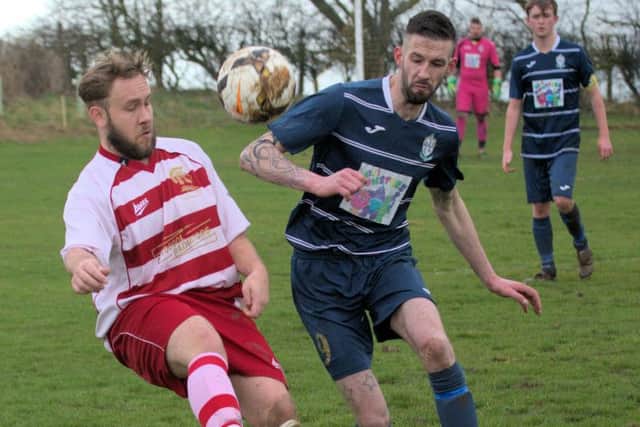 Fishburn and Cayton battle for possession. Picture by Brian Murfield.