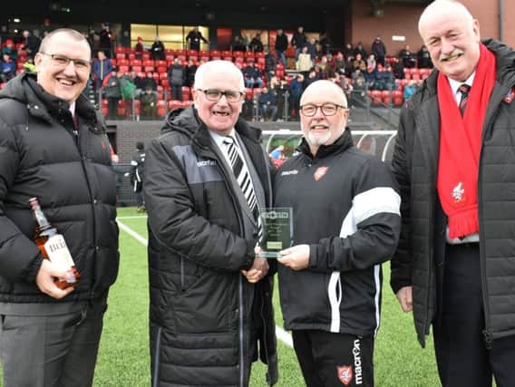 Boros Fred Firman, Steve Kittrick and Trevor Bull receiving the award from league representative Alan Ogley